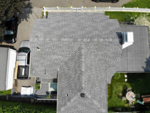 Aerial view of white home with GAF asphalt shingles