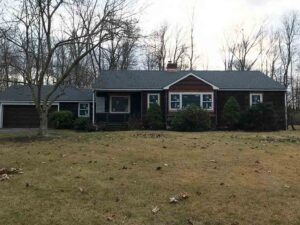 Front of home prior to siding replacement