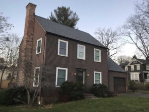 Brown siding on home before replacement