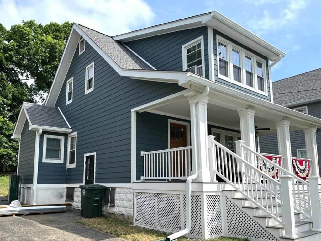 Side of home with James Hardie siding replacement in Port Chester