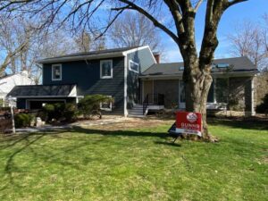 Front view of home with blue James Hardie siding