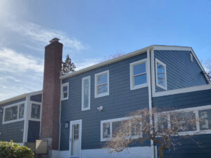 back view of home with blue James Hardie siding