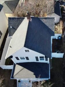 White home with dark gray asphalt shingles