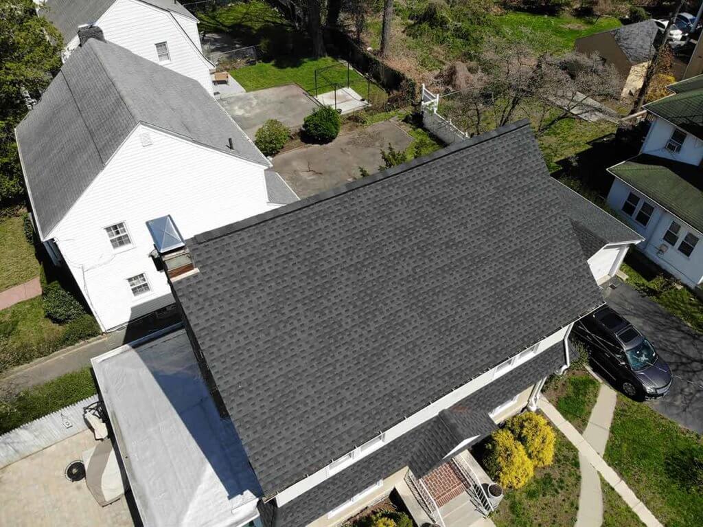 Aerial view of home with asphalt shingles