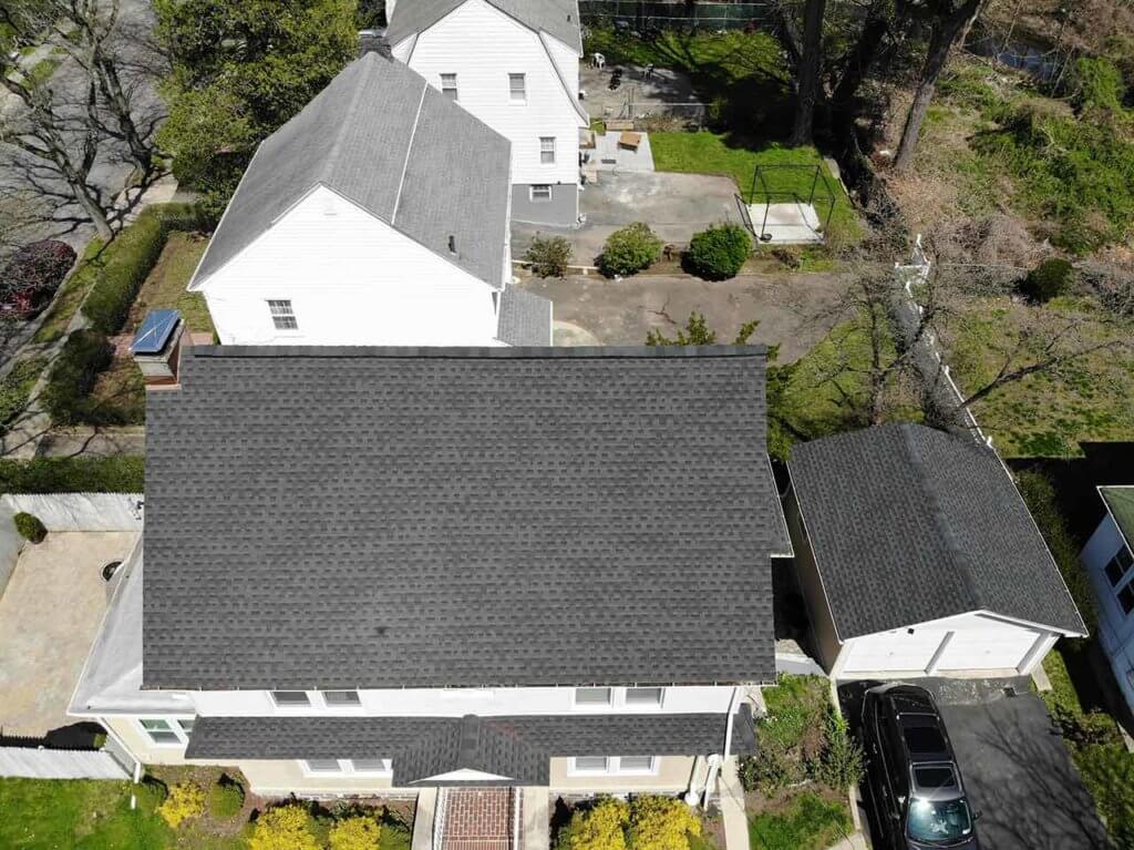 Aerial view of home with asphalt shingles