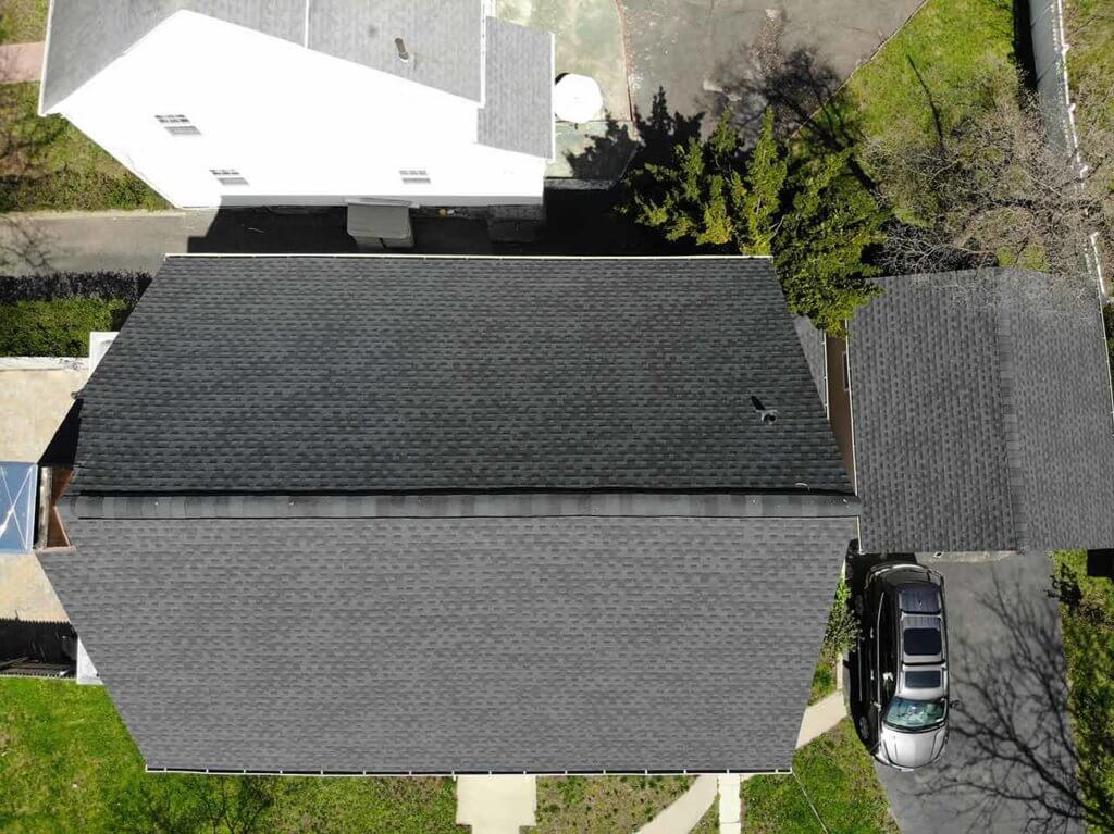 Aerial view of home with asphalt shingles