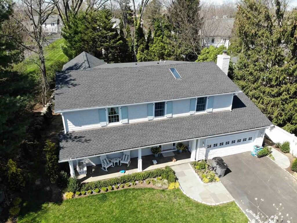 Aerial view of home with asphalt shingles