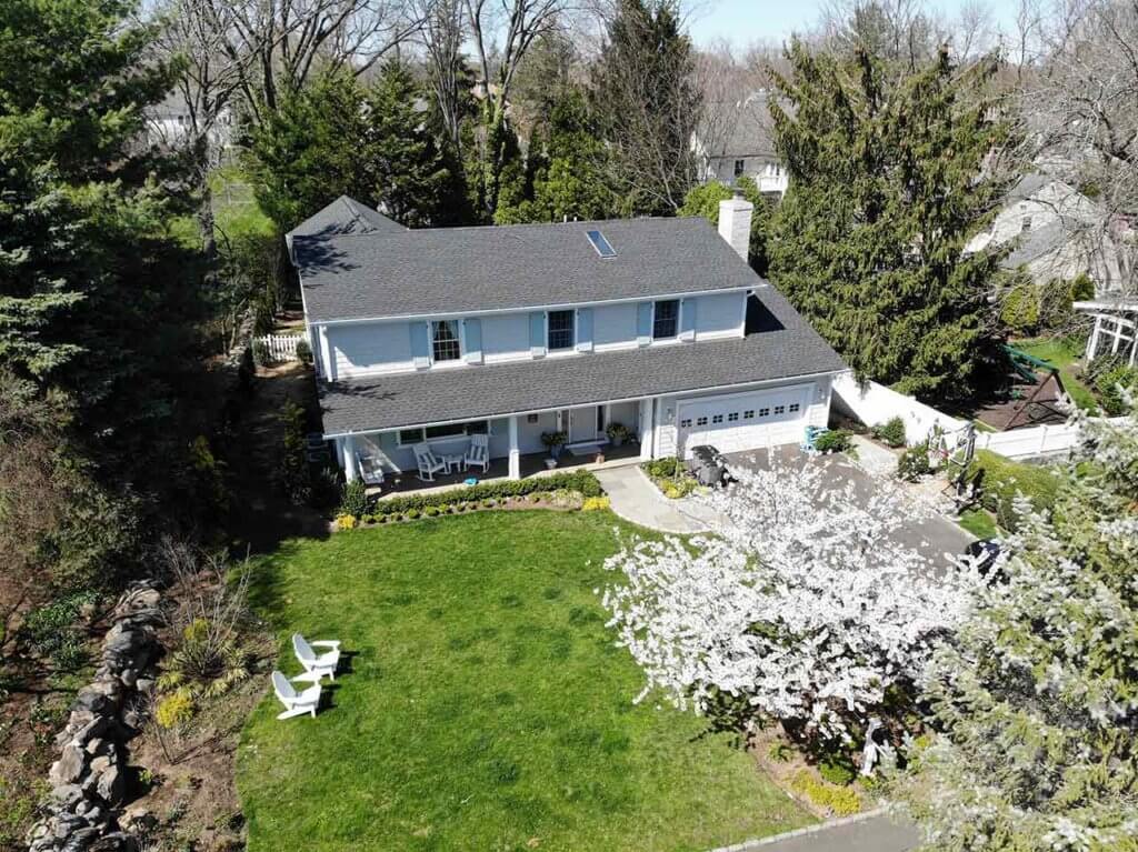 Aerial view of home with asphalt shingles