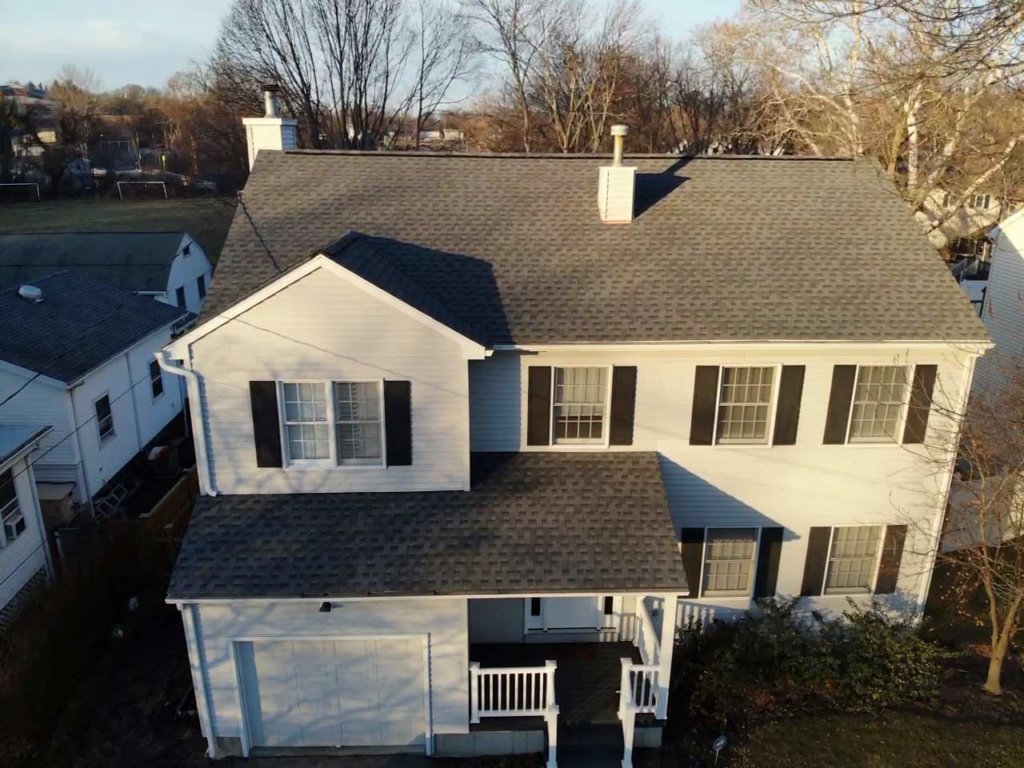 Aerial view of home with asphalt shingles