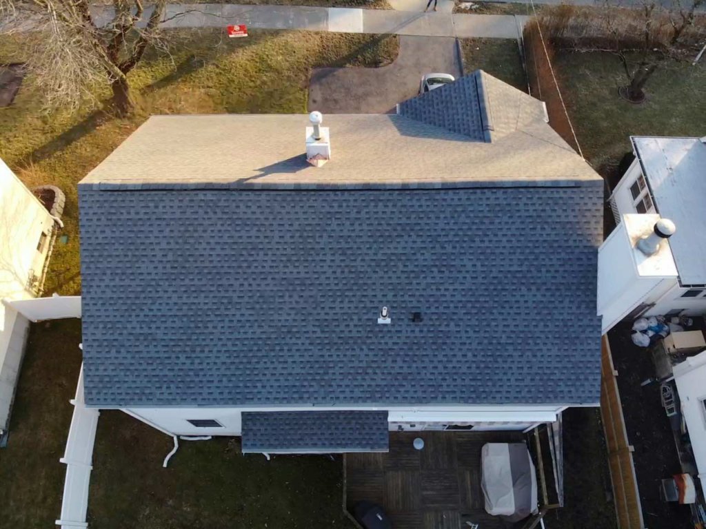 Aerial view of home with asphalt shingles