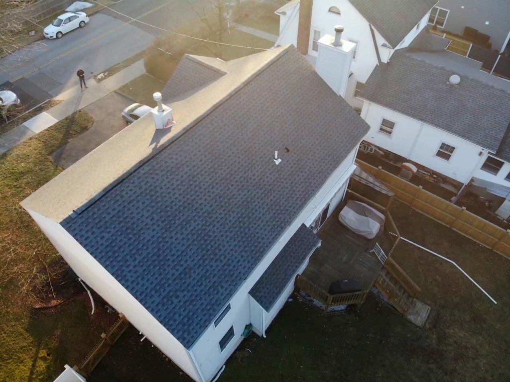 Aerial view of home with asphalt shingles