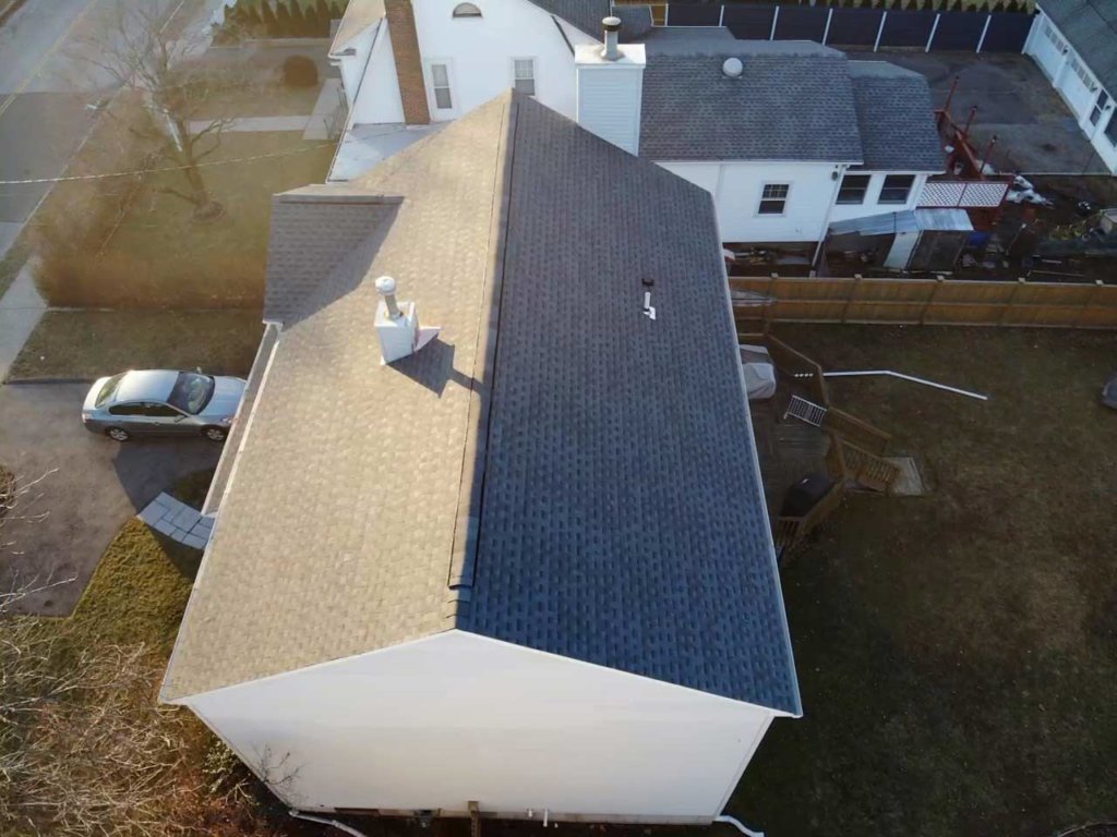 Aerial view of home with asphalt shingles