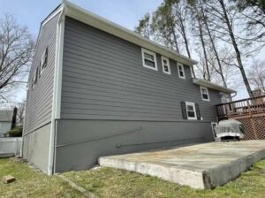 Back of home with dark gray James Hardie siding in White Plains