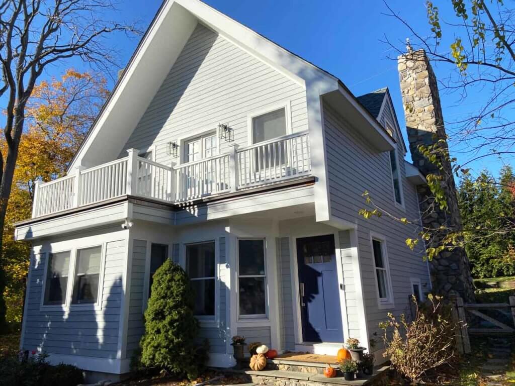 Home with rock chimney and James Hardie siding