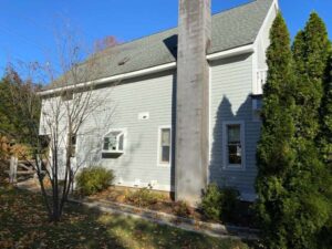 Side view of two-story home with white James Hardie siding