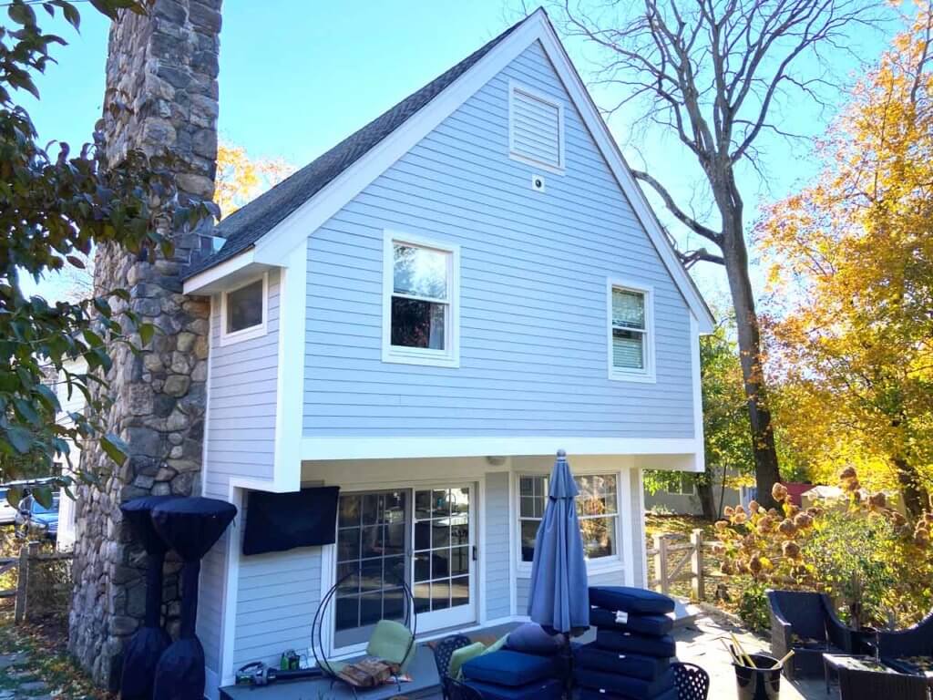 Home with rock chimney and James Hardie siding