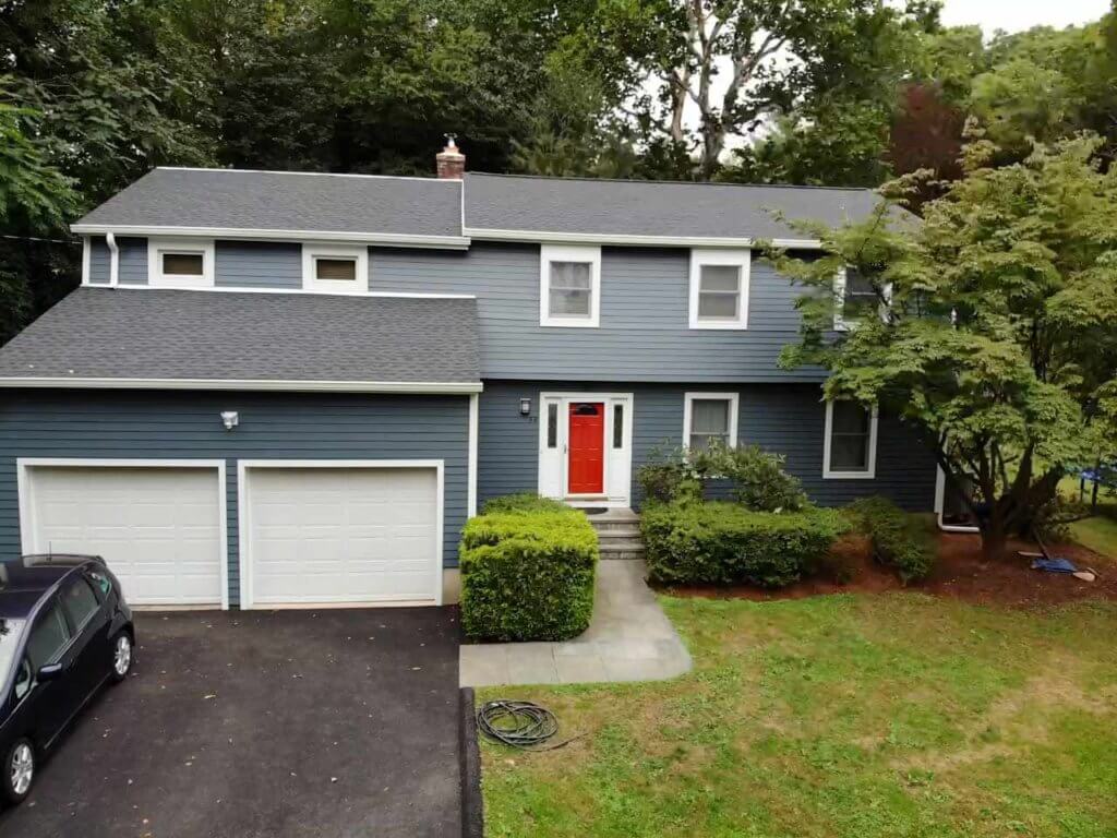 home with GAF asphalt shingles and James Hardie siding replacement