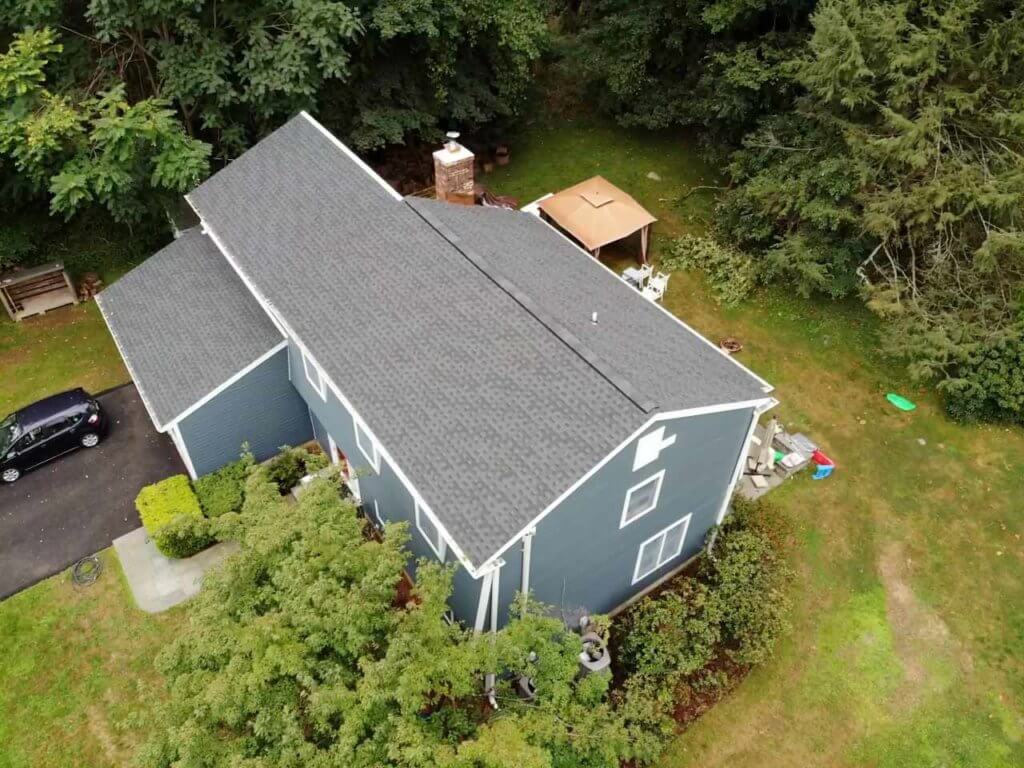 home with GAF asphalt shingles and James Hardie siding replacement