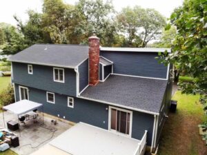 Back view of home with new roof and siding in Stamford, CT