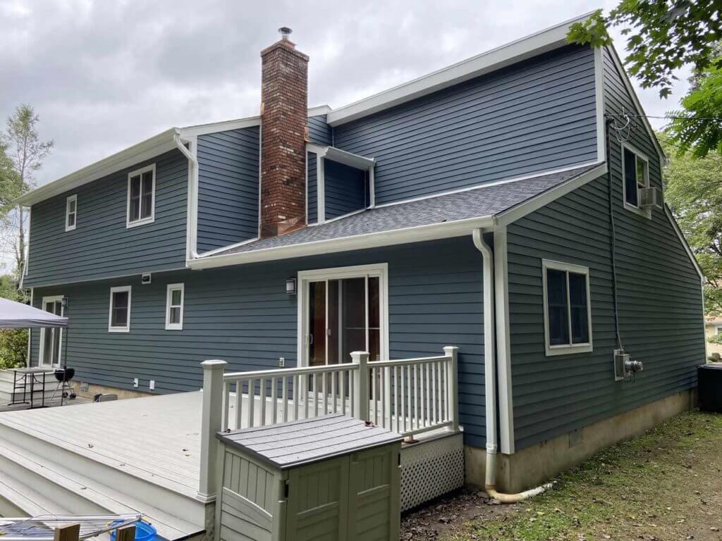 home with GAF asphalt shingles and James Hardie siding replacement