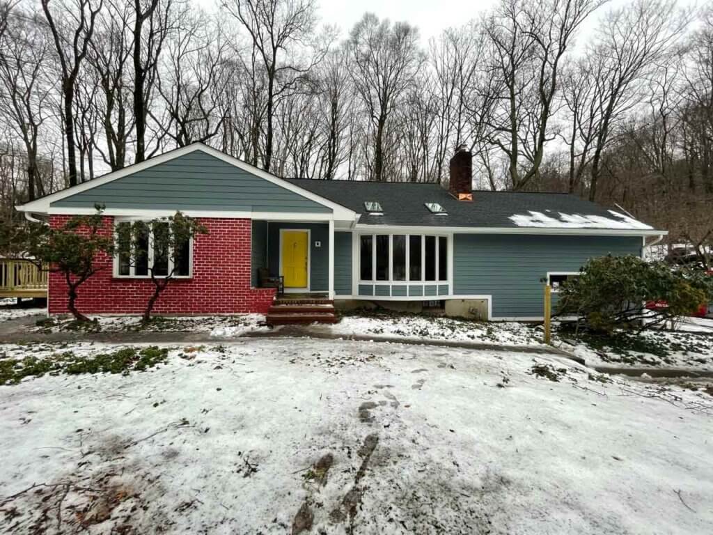 Side view of blue James Hardie siding on home