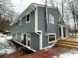 Rear view of home with Booth Bay Blue James Hardie siding