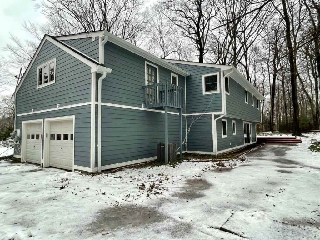 Side view of blue James Hardie siding on home