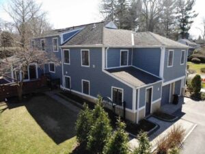 Rear view of home with blue James Hardie siding