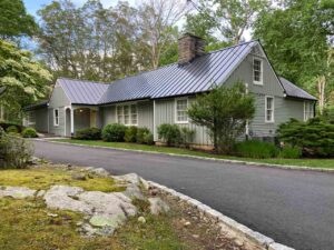 Front view of home with metal roof