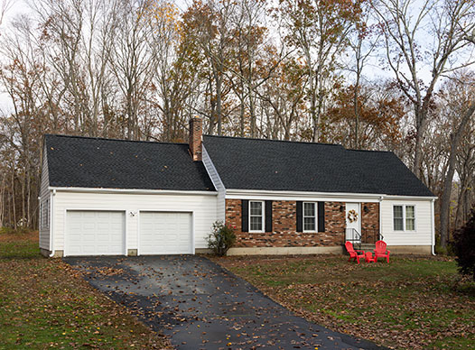 Brick home with white James Hardie siding