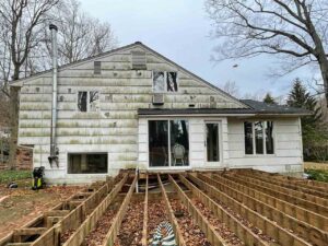 Exterior of home with damage to siding