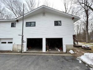 back view of home after window and siding repair