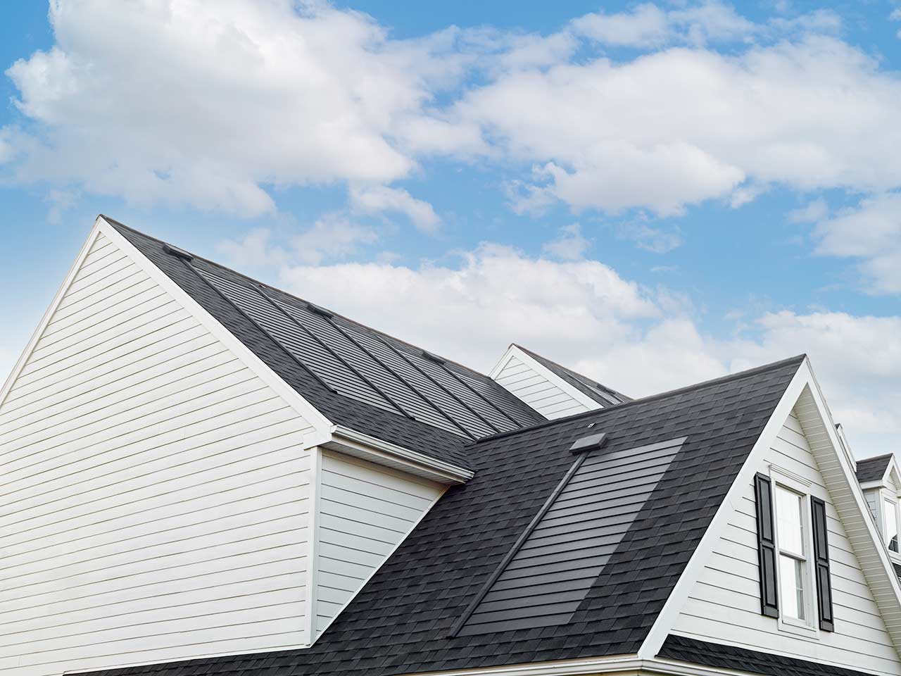 GAF Timberline solar shingles on white house