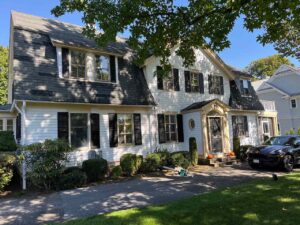 Front of home with trees in foreground