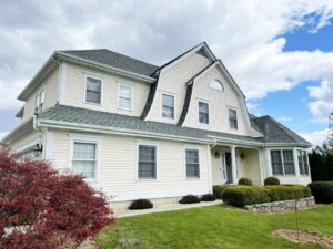 Home with beige siding and new Andersen windows