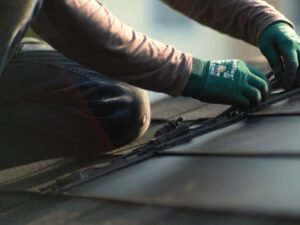 Closeup of GAF Timberline solar shingle installation in progress