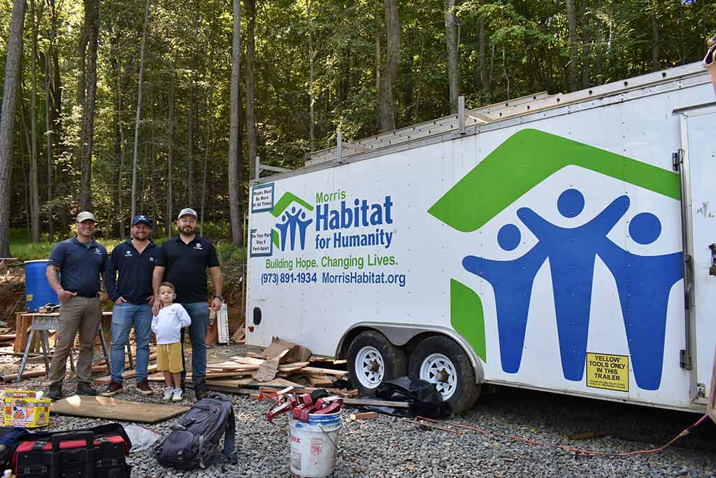 Gunner team next to Habitat for Humanity Trailer