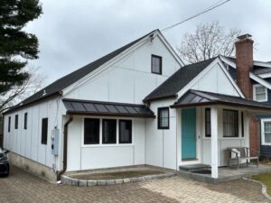 After installing white JamesHardie siding on a home