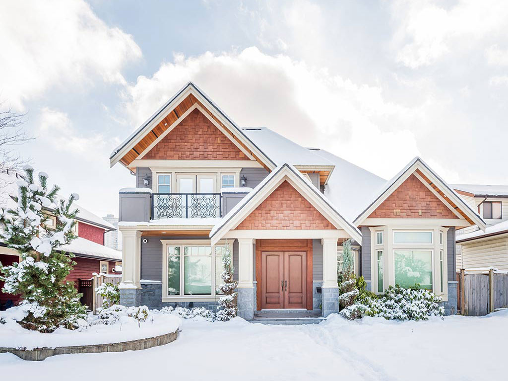 front view of house with snow on roof