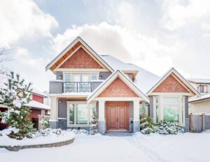 front view of house with snow on roof