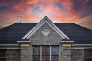 asphalt roof with sunset in the back