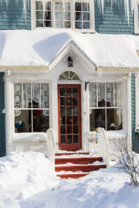 front porch covered in snow