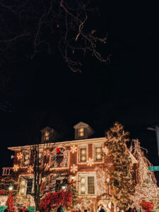 Lots of Christmas lights on house.