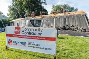 Gunner team installing roof for Habitat for Humanity