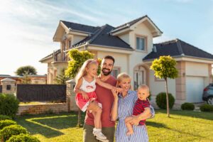 family in front of home